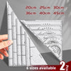 A set of precision triangular drafting rulers in various sizes, showing different scales and angles.