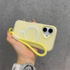 A hand holds a yellow phone case with a white ring design and a yellow lanyard.