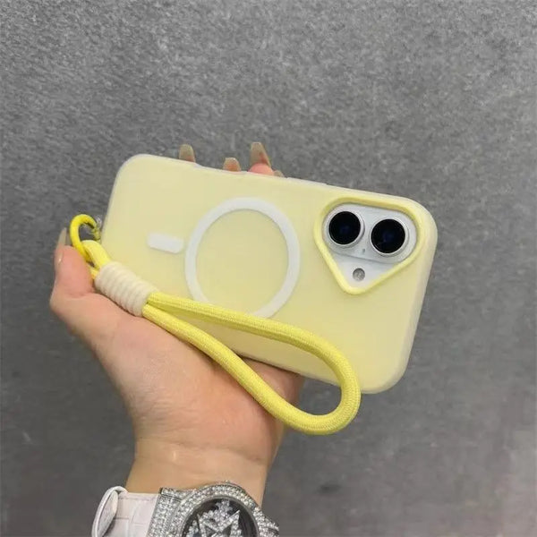 A hand holds a yellow phone case with a white ring design and a yellow lanyard.