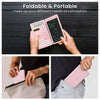 A hand holds a pink foldable scientific calculator with a built-in notepad, demonstrating its portable design.