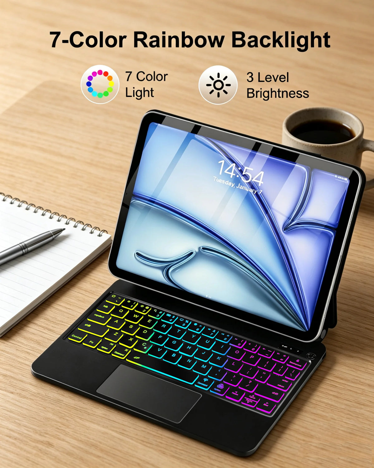 A black Magic Keyboard case for an iPad displaying a colorful rainbow backlight on the keyboard keys.