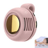A pink portable mini blade-less electric fan with a circular grille and a small decorative symbol.