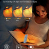 A woman reads a book using a professional eye protection LED light with adjustable brightness settings.