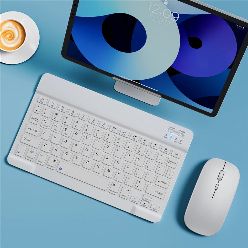 A white portable Bluetooth keyboard is shown next to an iPad displaying a blue and purple interface.