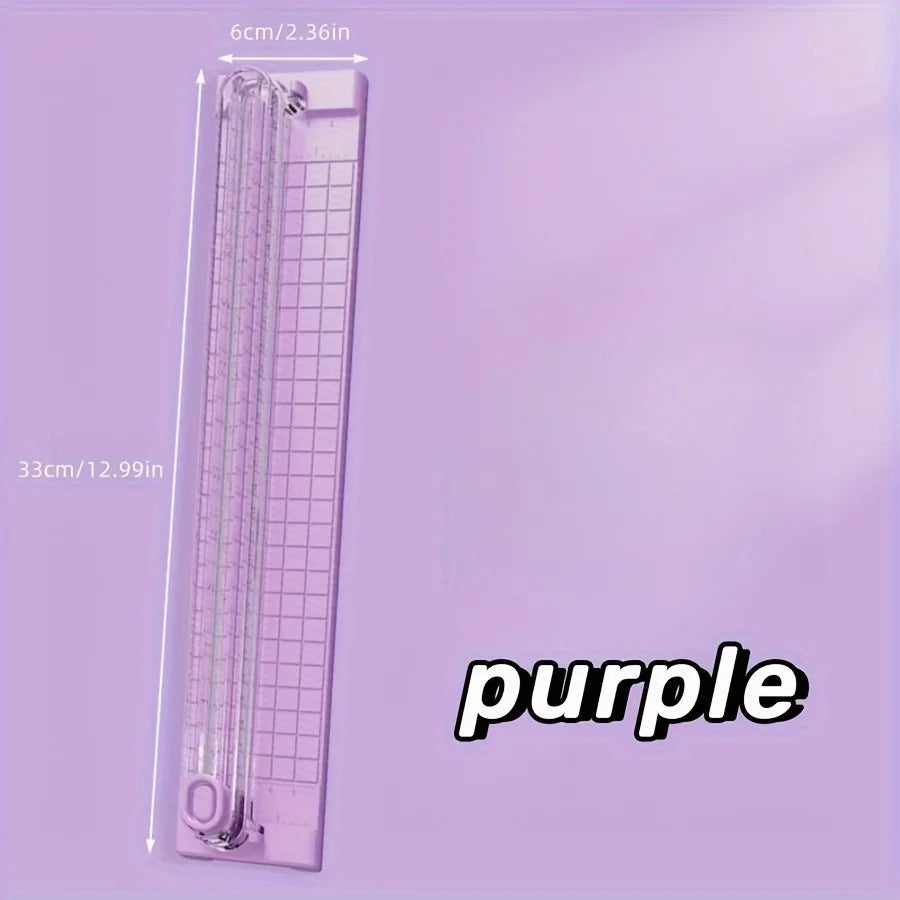 A purple portable manual paper cutter trimmer with dimensions 33cm by 6cm.