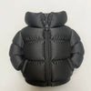 Black puffer jacket with a zipper and quilted texture.