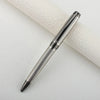 A silver metal ballpoint pen with a textured body is shown diagonally on a white surface.