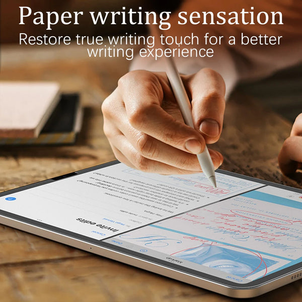 A hand writes on an iPad screen with a stylus, demonstrating a paper writing sensation experience.