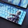 A close-up view of a keyboard featuring Raven Sakura theme PBT mechanical keycaps on a dark surface.