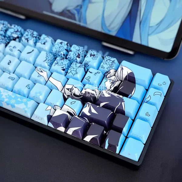 A close-up view of a keyboard featuring Raven Sakura theme PBT mechanical keycaps on a dark surface.