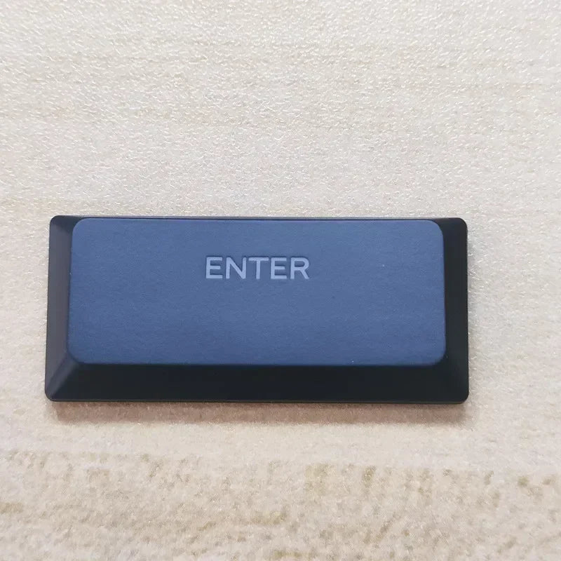A dark blue keycap labeled ENTER for a Dell Alienware AW510K keyboard.