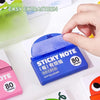 A hand is extracting a blue sticky note package labeled STICKY NOTE 80 Sheets from its packaging.