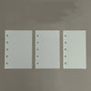 A set of ten transparent divider pages for M5 and A8 loose-leaf planners, showing blank white sheets with punched holes.