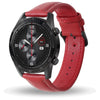 A red leather watch with a black face and silver accents, shown on a wrist.