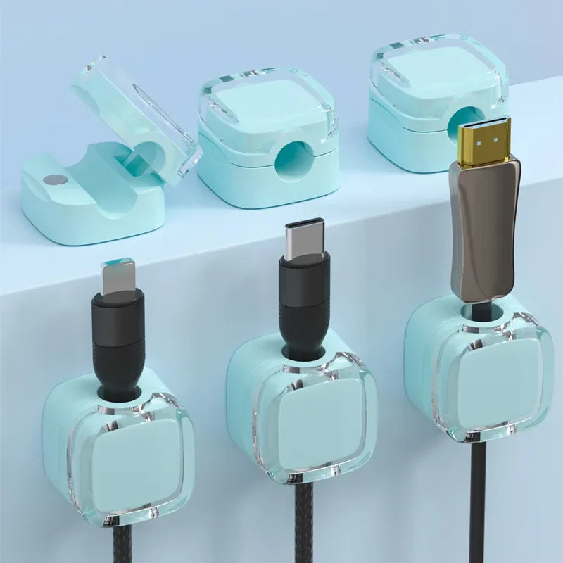 A set of light blue magnetic cable management clips for organizing wires on desks and walls.
