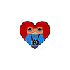 An enamel pin featuring a sarcastic frog face inside a red heart shape.