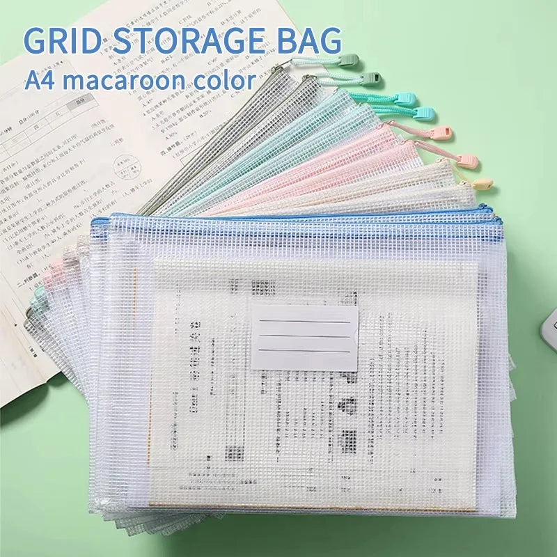 A stack of colorful mesh storage bags and a white document pouch are displayed on a light green surface.
