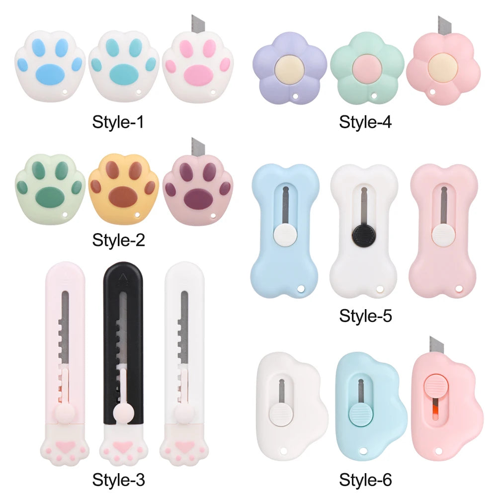 Eine Sammlung von sechs Stilen ausziehbarer Taschenmesser und Boxcutter in verschiedenen Farben wie Weiß, Pink, Lila, Grau