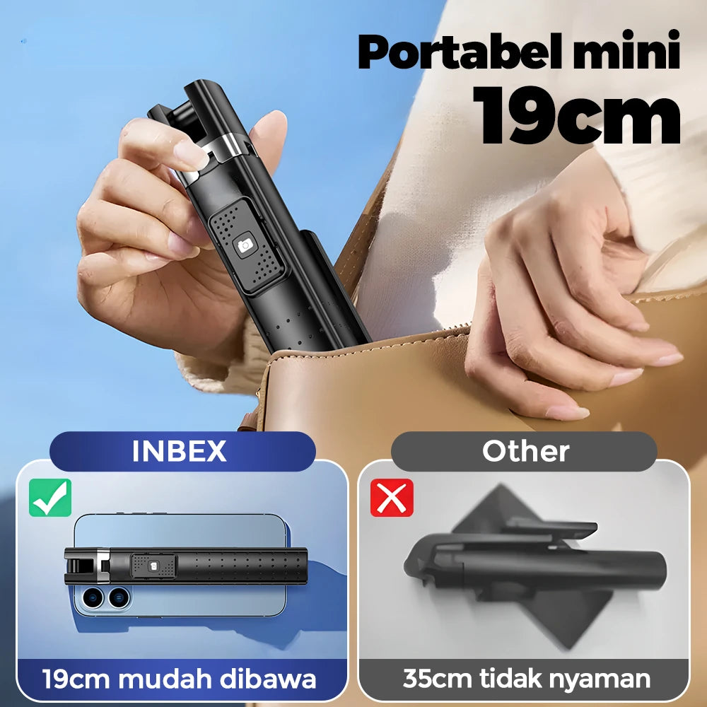 A hand holds a black portable mini 19cm Bluetooth selfie stick tripod for phone photography.