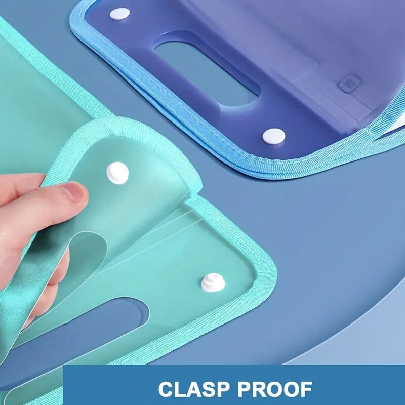A hand is opening a teal accordion file organizer with a blue clasp proof cover.