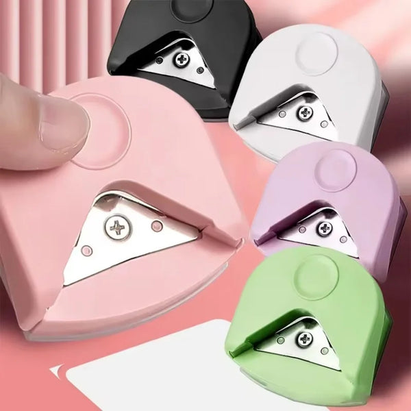 Ein Set aus fünf Präzisions-Eckencutter in rosa, schwarz, weiß, lila und grün für Bastel- und DIY-Projekte.