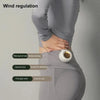 A person is demonstrating wind regulation on a gray garment, showing three levels of wind effect.