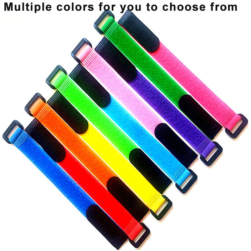 A variety of colorful reusable hook and loop cable ties are displayed in a fan arrangement.