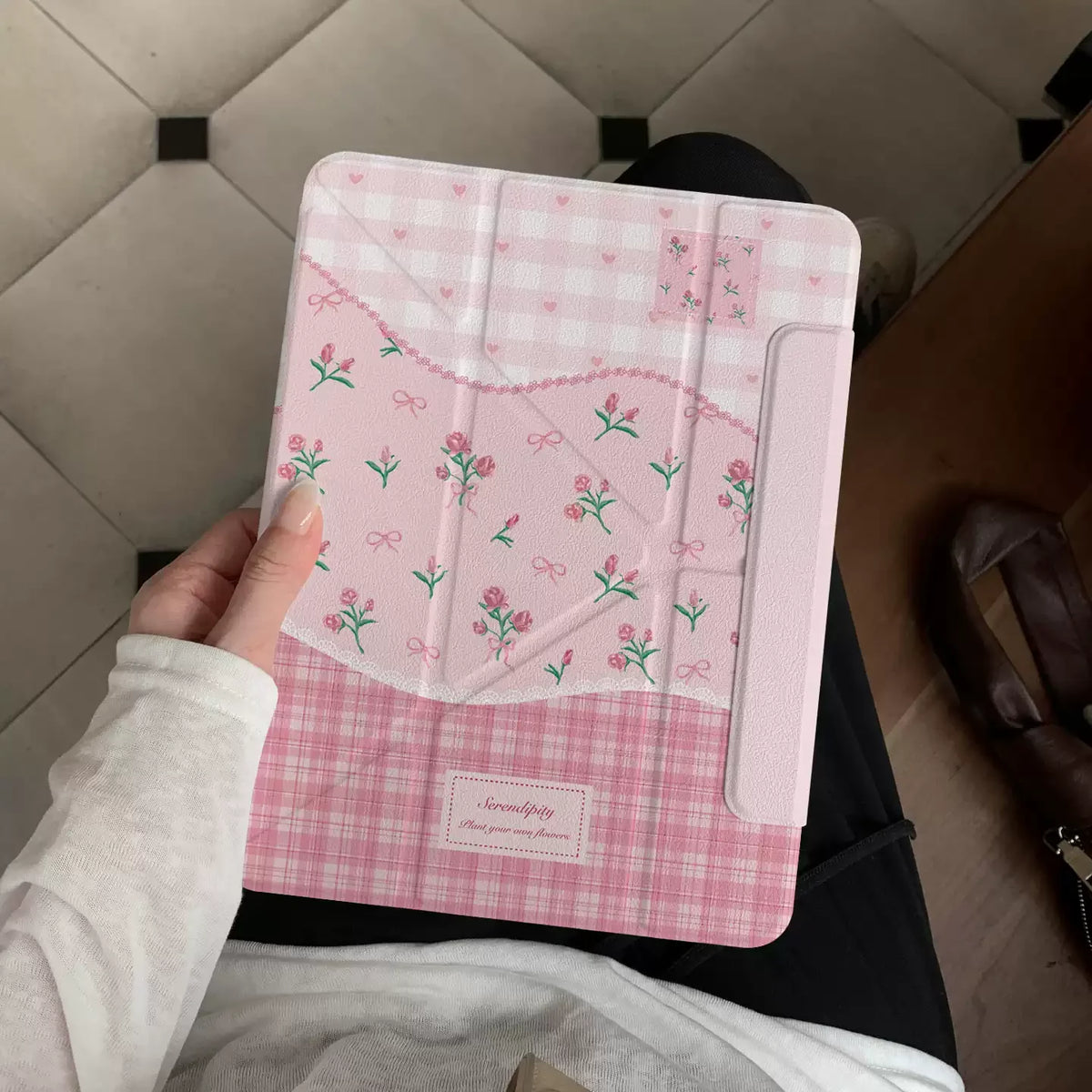 Pink floral print magnetic iPad case with stand featuring a gingham pattern.