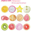 A set of 36 fruit-shaped sticky notes including citrus slices, kiwi, watermelon, and apple.