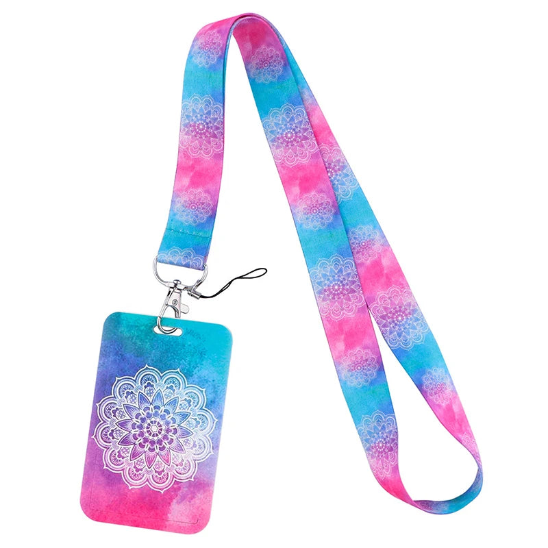 A pink and blue floral patterned lanyard with a turquoise tag attached to a metal clip.