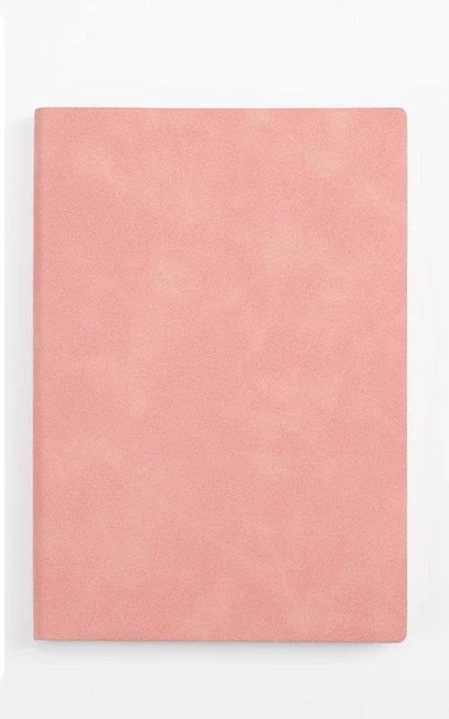 A solid dusty rose colored A5 leather journal or diary.