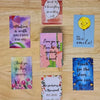 A collection of nine colorful motivational greeting cards featuring positive messages and illustrations.