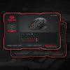 A close-up view of a black wireless MMO gaming mouse with red accents and RGB lighting displayed on a dark background.