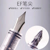 A close-up view of an EF fountain pen with a silver tip and clear barrel, highlighting its fine point design.