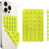 A white smartphone case with a yellow silicone suction cup mount for grip and stand functionality.