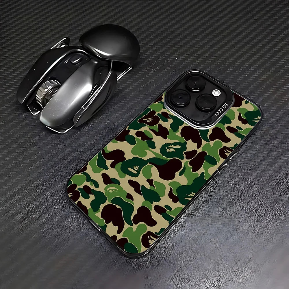 A black iPhone case featuring a leopard print camouflage pattern, placed next to the phone.