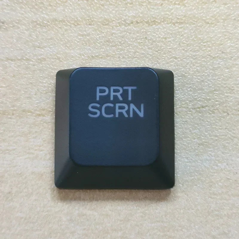 A dark gray keycap labeled PRT SCRN for a Dell Alienware keyboard.
