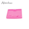A pink silicone resin mold with various indentations for crafting and DIY projects.