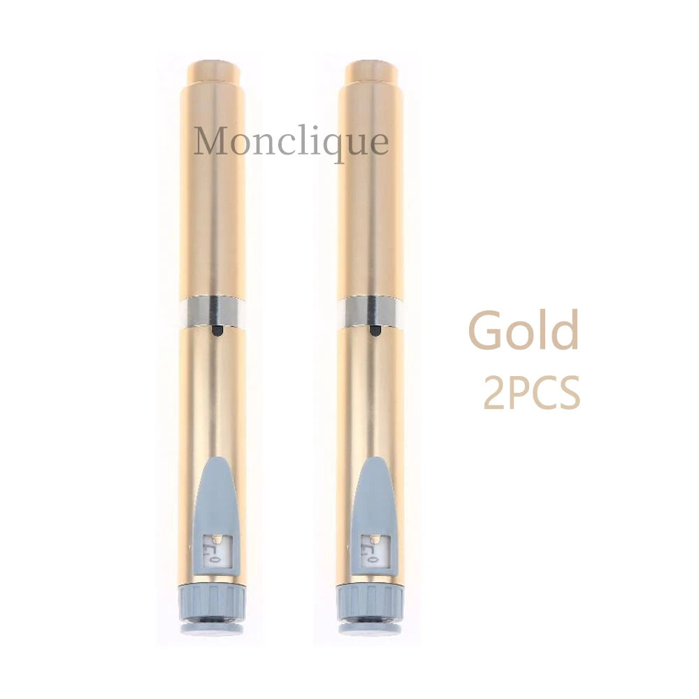 A pair of gold reusable metal injection pens shown against a white background.