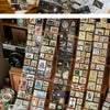 A collection of vintage stamp tape stickers and paper ephemera arranged for scrapbooking.