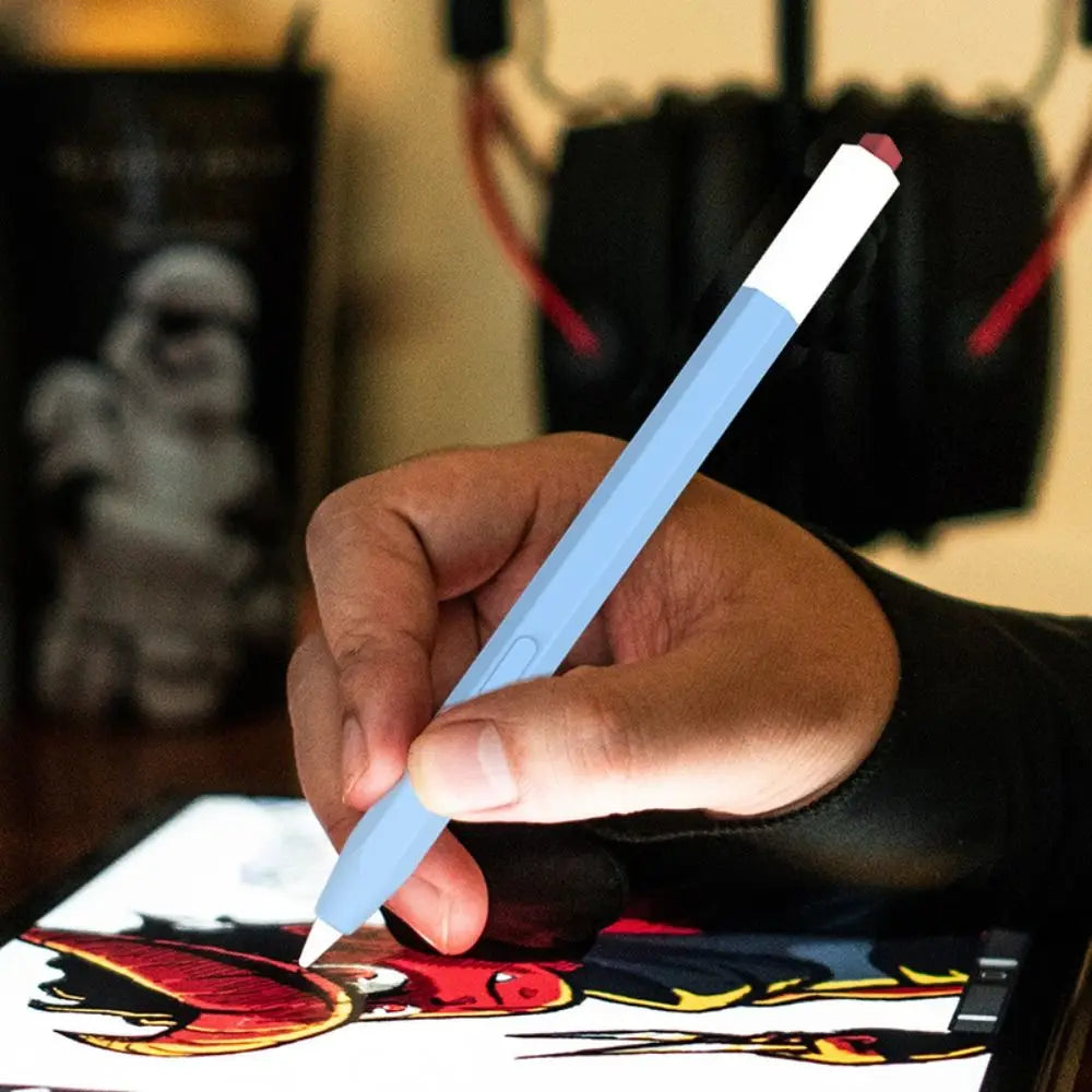 A hand holds a light blue stylus pen over a digital screen displaying artwork.