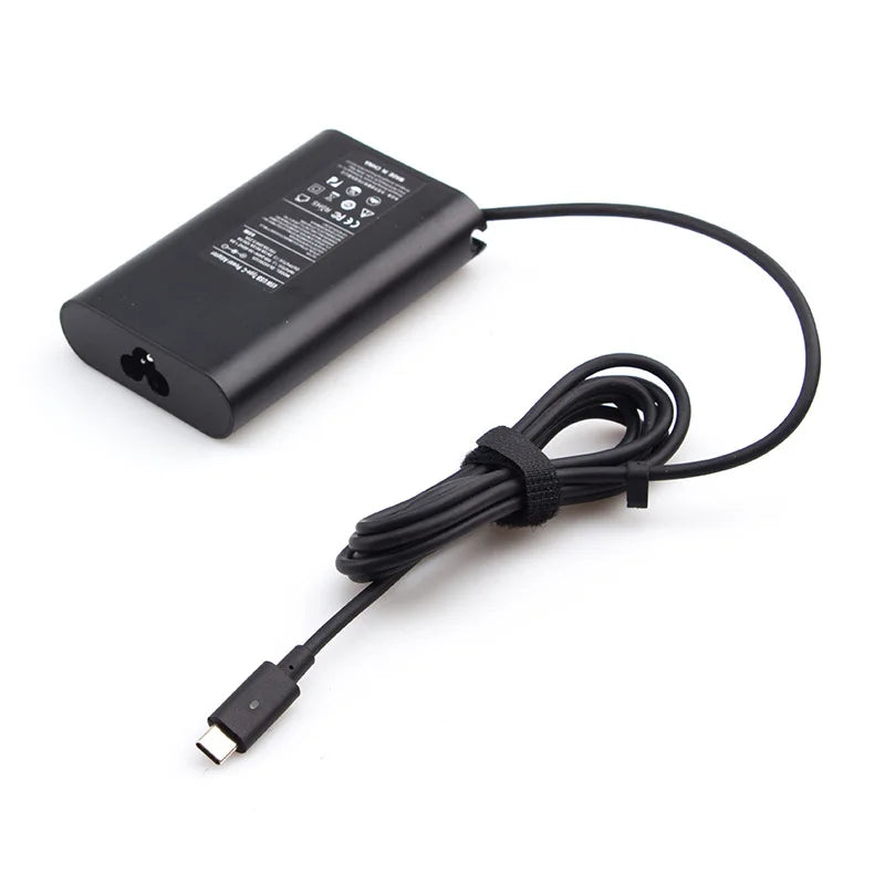 Black 130W USB-C laptop charger with a coiled black cable.