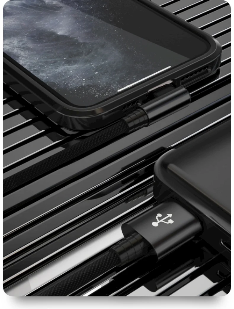 A close-up view of a black braided lightning cable connecting an iPhone to a charging port.