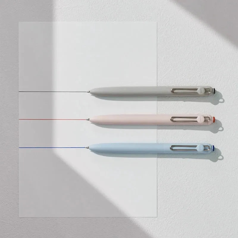 Three precision gel pens in white, pink, and light blue are displayed against a white background.