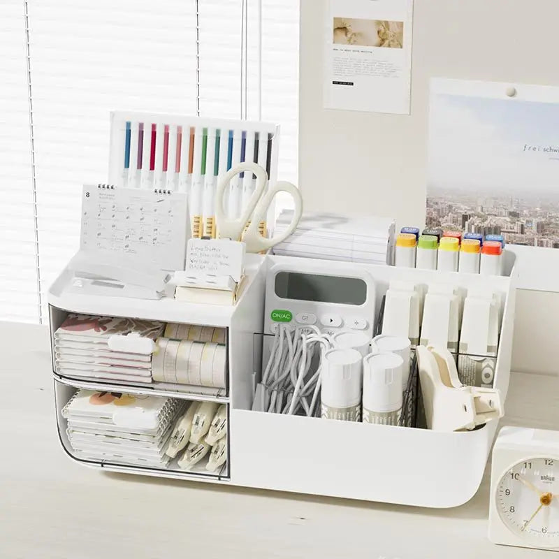 A white multifunctional desk organizer with two clear storage drawers holding pens, pencils, and office supplies.
