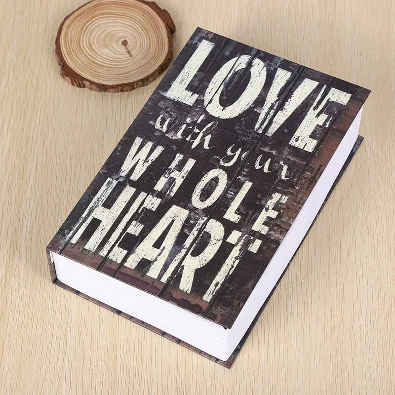 A dark wooden book with white text that reads Love with your whole heart resting on a light wood surface.