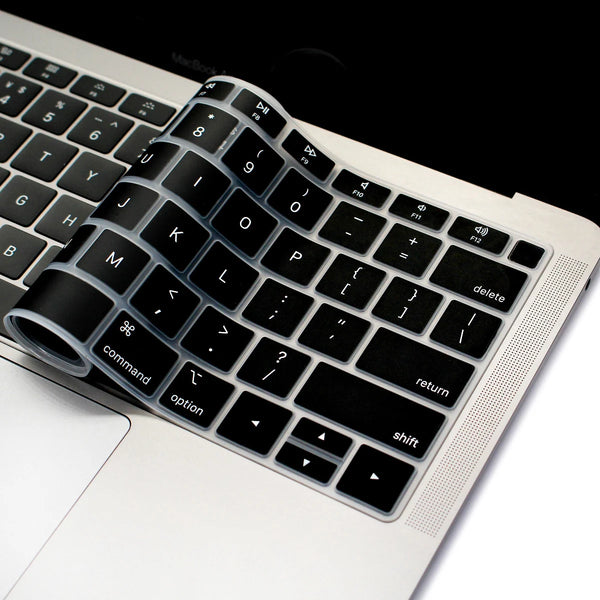 A close-up view of a silicone keyboard cover placed on a white laptop, showing the keys and surrounding area.