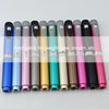 A row of reusable injection pens in various colors, including blue, pink, green, and black.