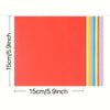 A sheet of bright orange cardstock with vertical stripes of blue, yellow, and pink.