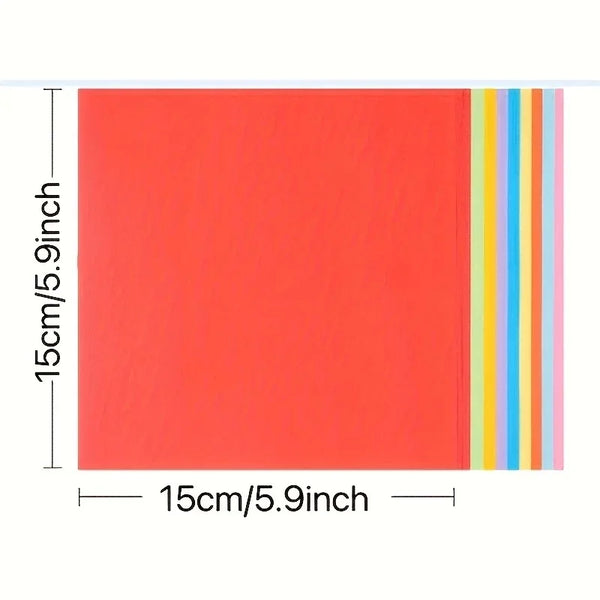 Ein Blatt leuchtend orangefarbenen Karton mit vertikalen Streifen aus Blau, Gelb und Pink.